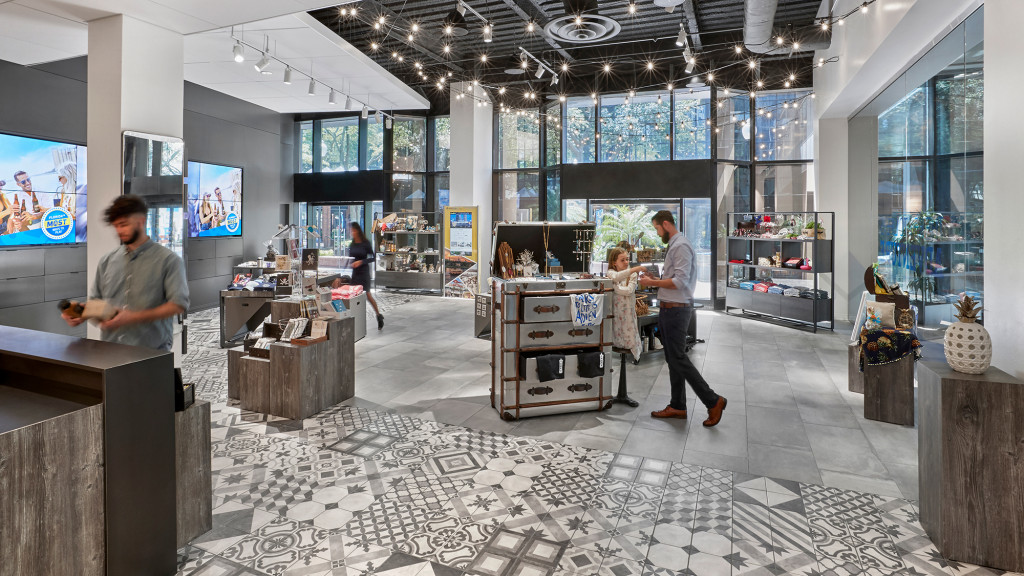 People in a room with a display.